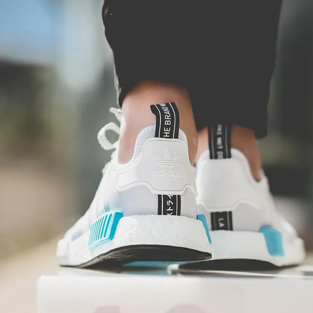 Adidas NMD R1 Reflective White Bright Cyan sneakers.