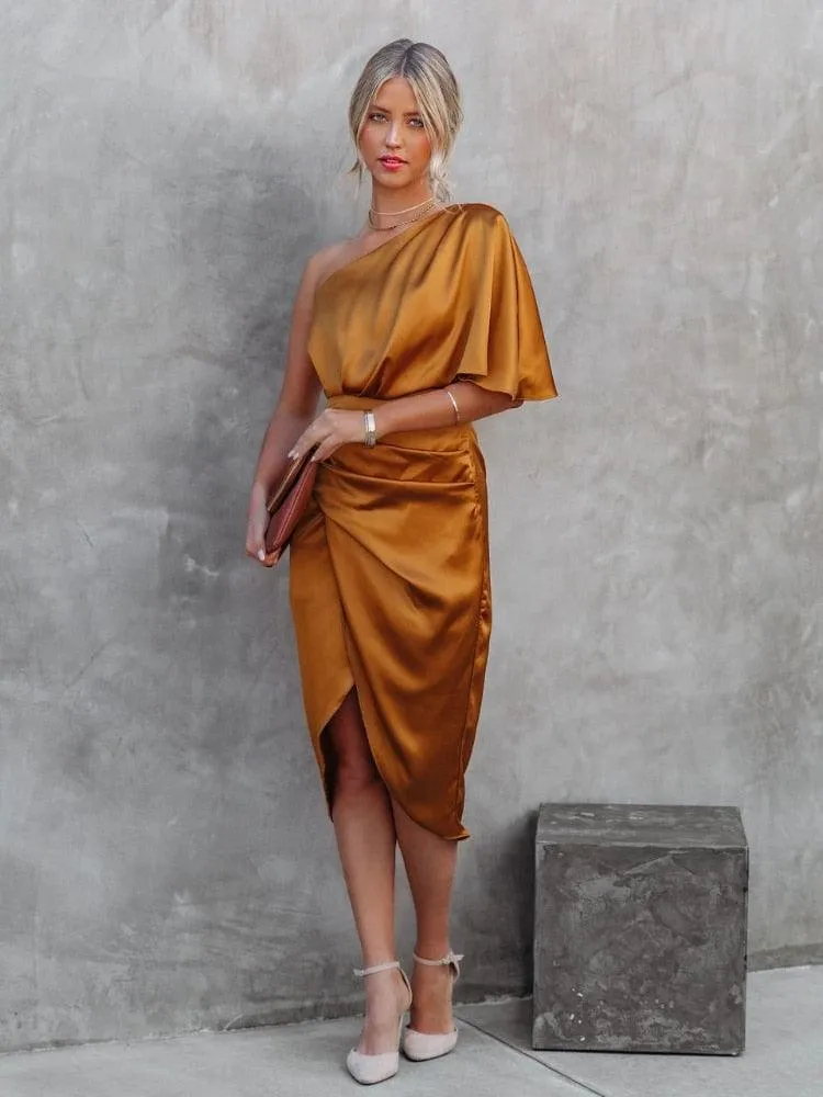 Silk robe dress with satin short sleeves, one shoulder, high split, and ruched details.