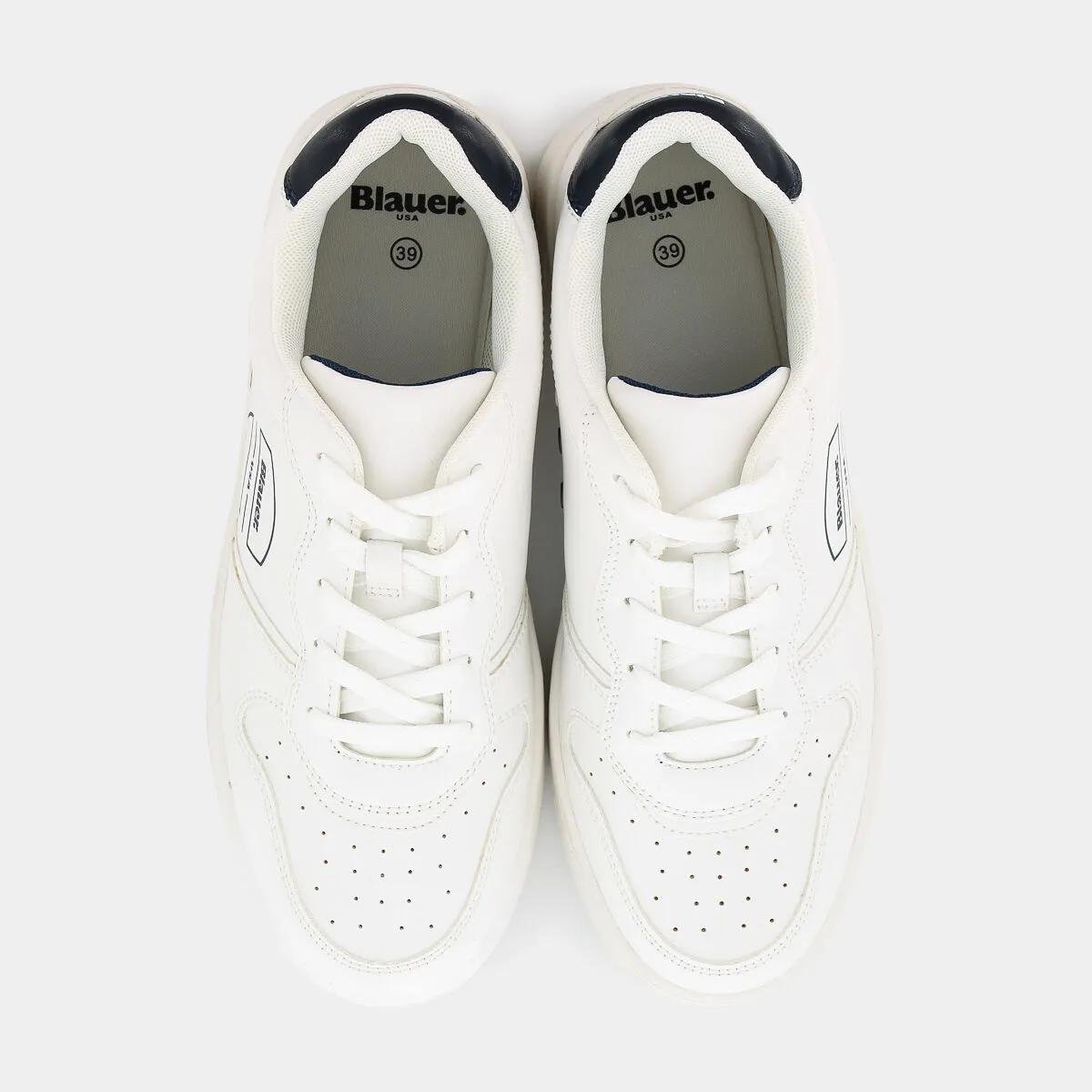 White spike navy sneakers.